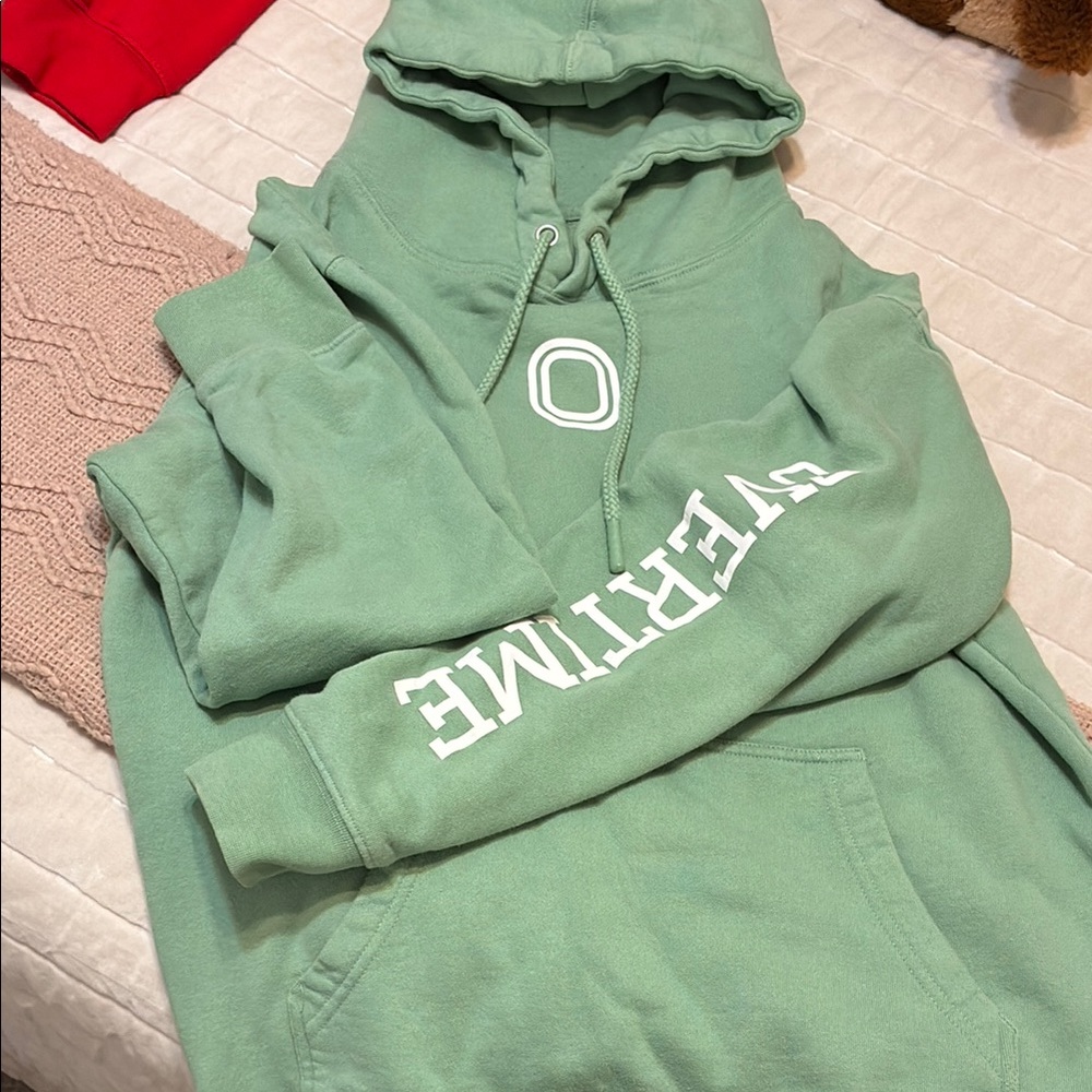 Cozy Green Sweater with Graphic Details